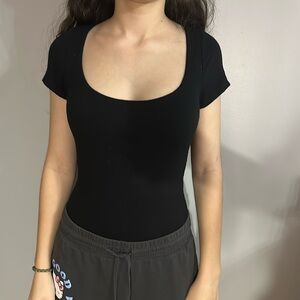 XS Black Bodysuit. Worn several times but is in great condition. Is lightweight.